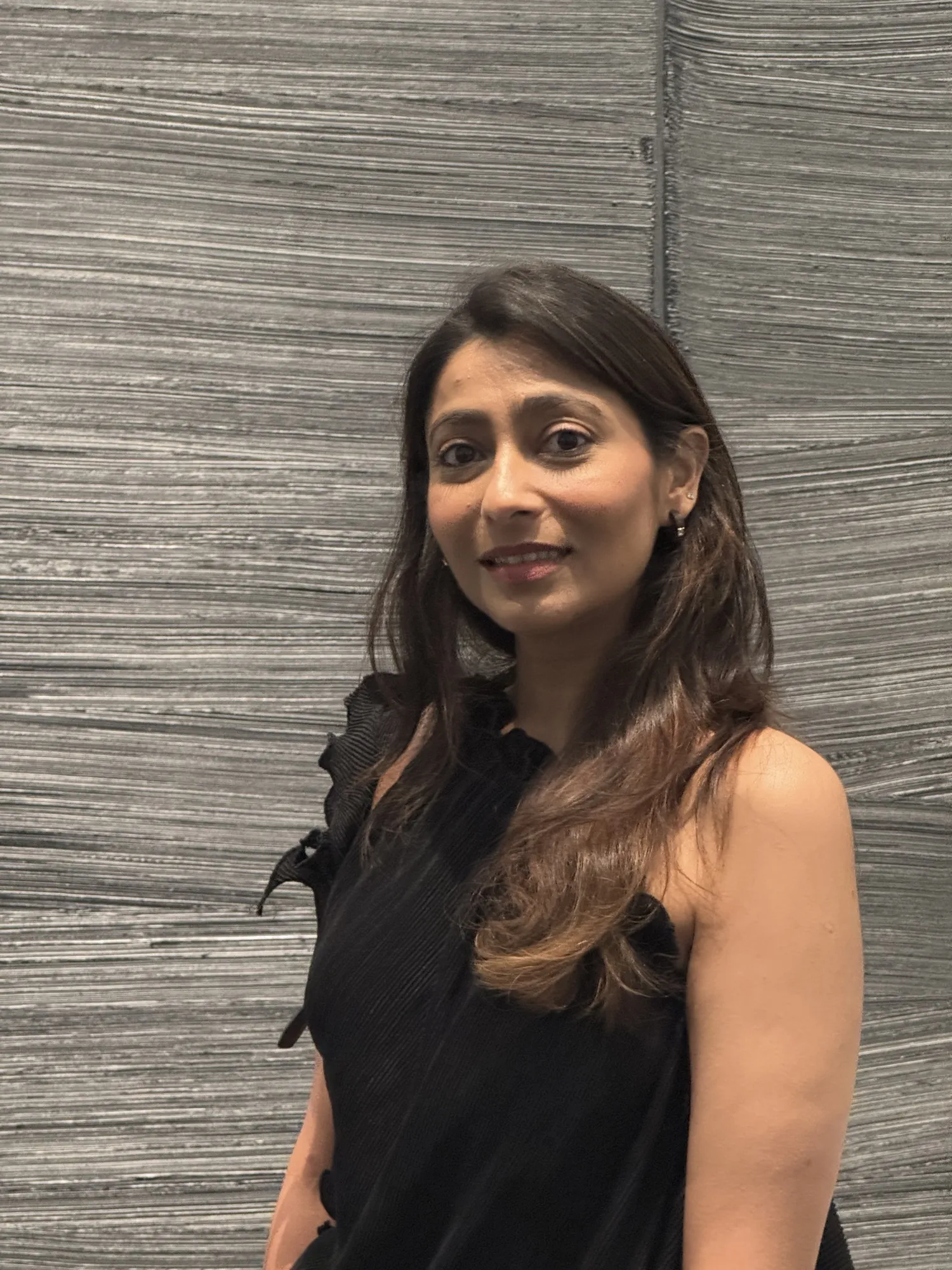 Paulomee Mehra, matchmaker, photographed in a gallery